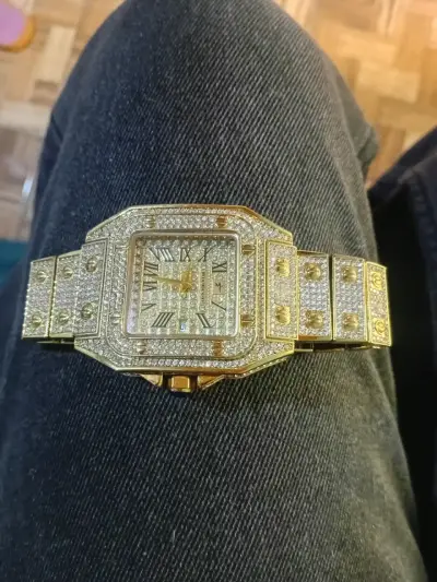 Reloj dorado con gemas - miniatura 1