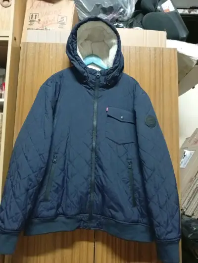 Chaqueta acolchada azul con capucha - miniatura 1