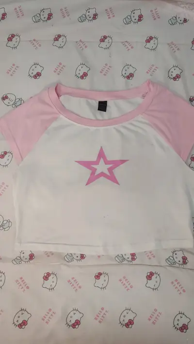 Polera blanca con estrella rosa - miniatura 1