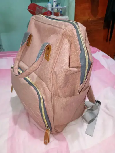 Mochila rosa multiuso - miniatura 1