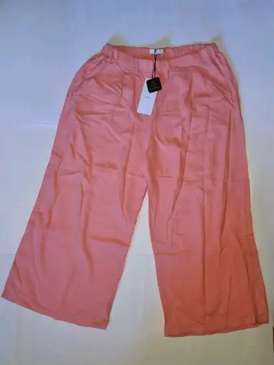 Pantalones rosados con etiqueta - miniatura 1