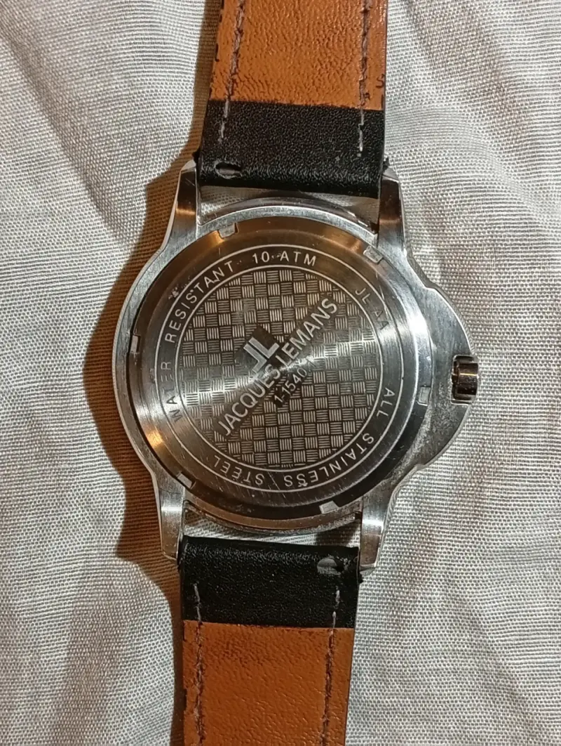 Reloj análogo negro,marca Jacques Lemans. - 2