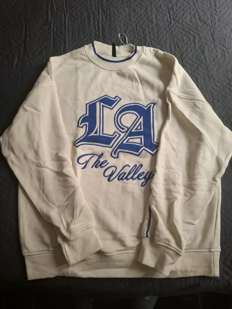 Polerón beige con estampado LA