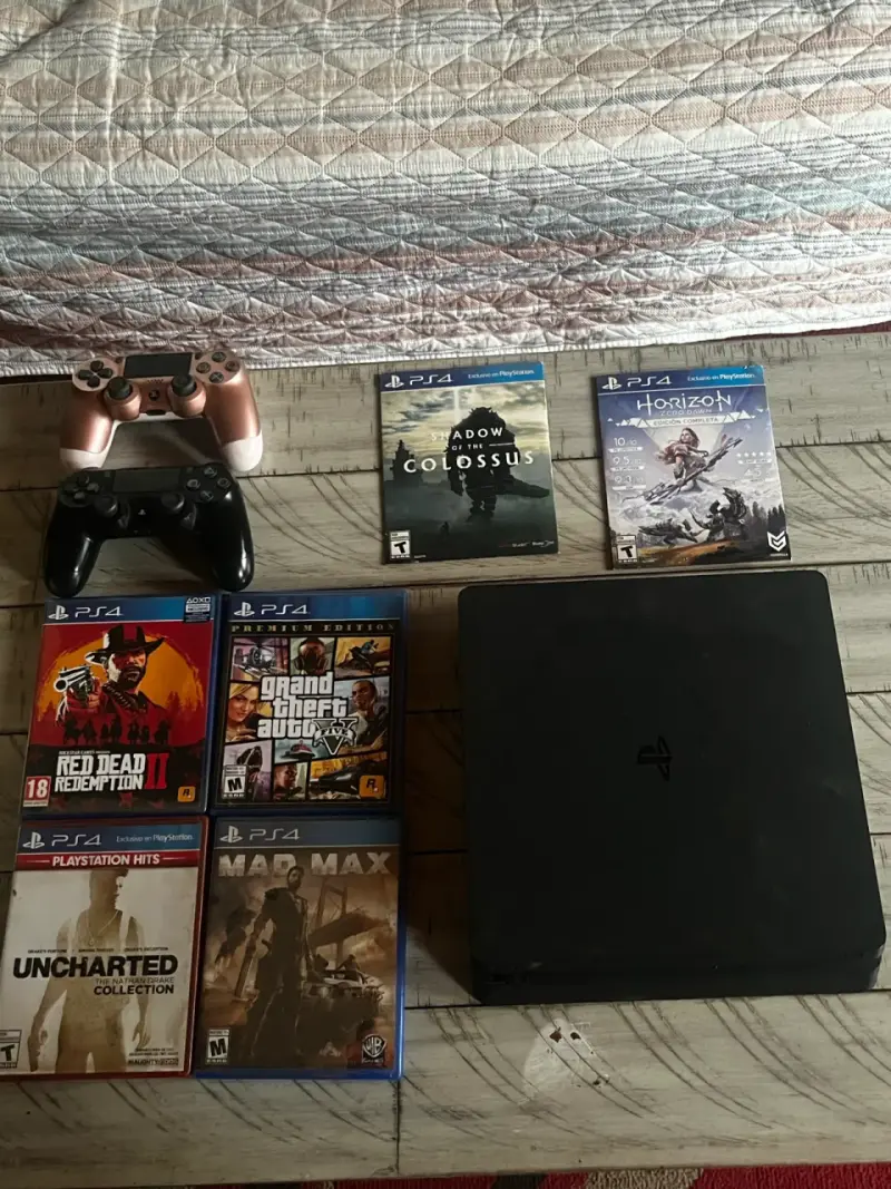 Consola PS4 con controles y juegos - 1