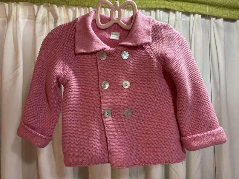 Abrigo rosado de lana para niña