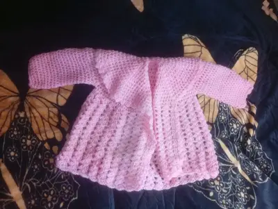 Chaleco tejido rosado infantil - miniatura 1