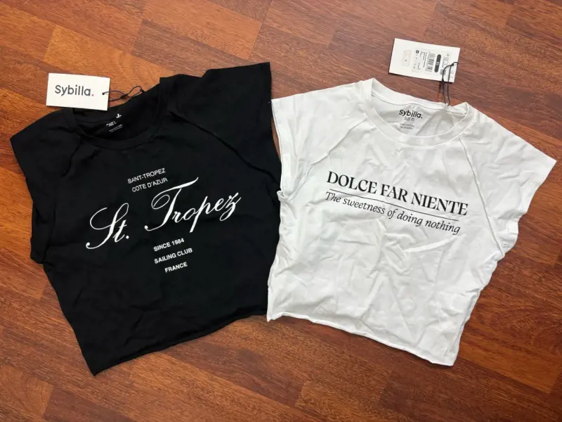 Poleras negras y blancas Sybilla