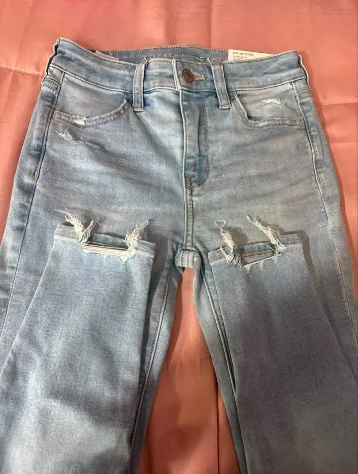Jeans claros rasgados dama - 1