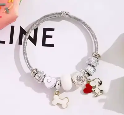 Pulsera de metal con dijes - miniatura 1