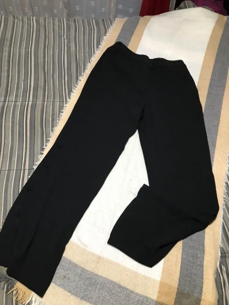 Pantalones negros tela con botones - 1