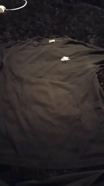 Polera negra Nike - miniatura 1