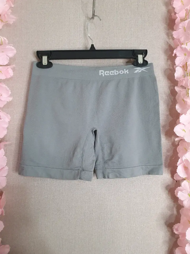 Shorts deportivos gris Reebok - 1