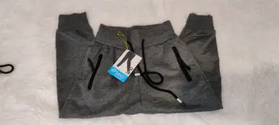 Pantalones deportivos gris oscuros nuevos - miniatura 1