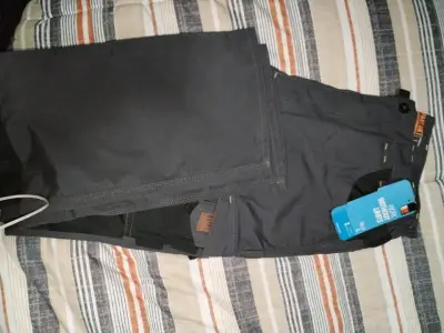 Pantalones de trabajo grises nuevos - miniatura 1