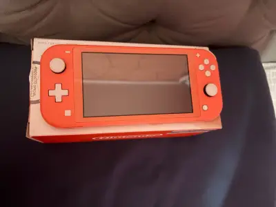 Nintendo Switch Lite Coral 32GB - miniatura 3