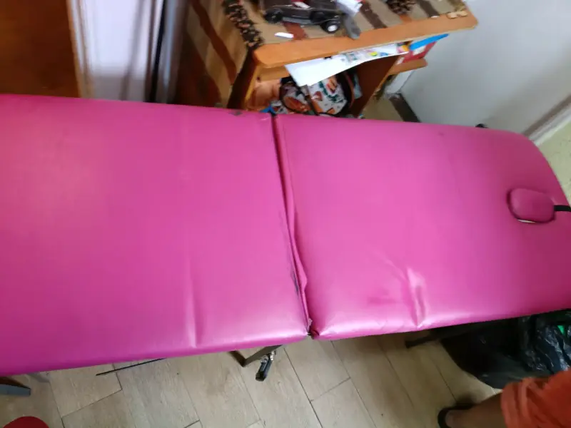 Camilla de masaje plegable fucsia