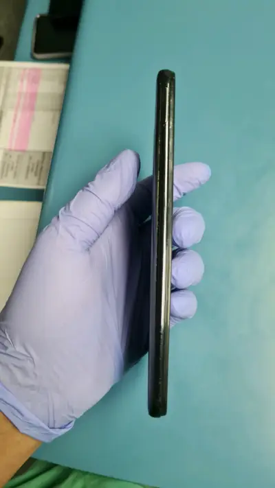 Teléfono móvil negro usado - miniatura 3