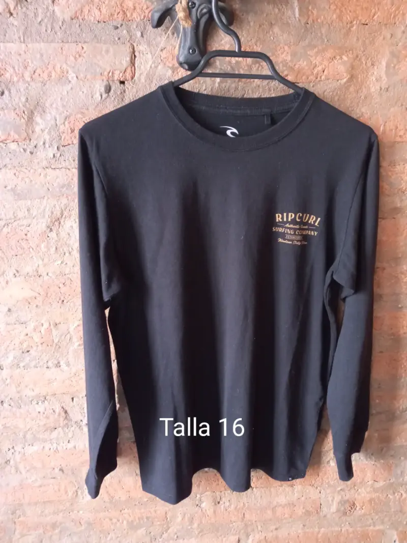 Polera negra Rip Curl manga larga - 1