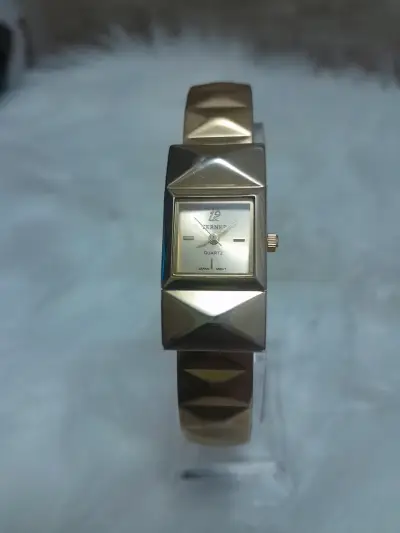 Reloj de pulsera dorado - miniatura 1