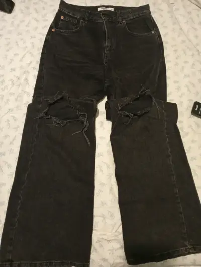 Jeans negros rotos unisex - miniatura 1