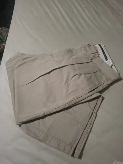 Pantalones beige con pliegues - miniatura 2