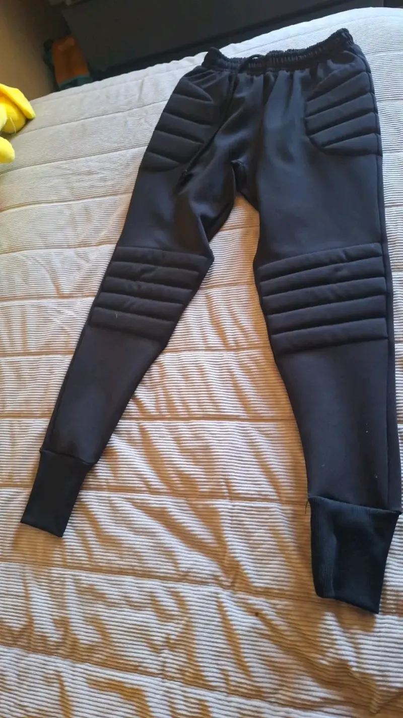 Pantalones acolchados negros arquero