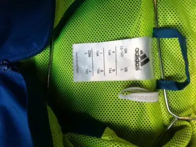 Cortaviento Adidas azul y amarillo - miniatura 3