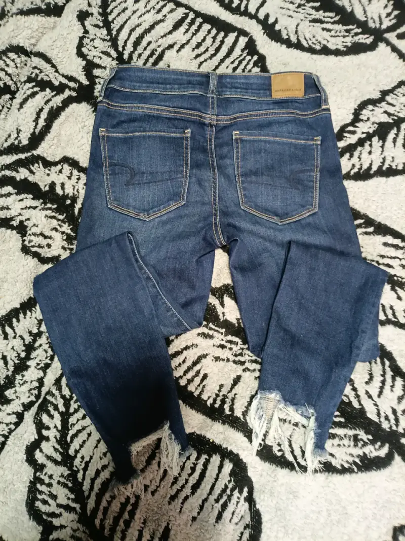 Jeans azul rasgados de mujer - 4