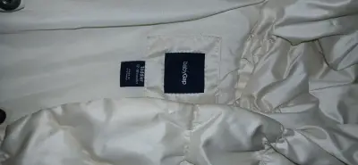 Chaqueta acolchada beige para bebé - miniatura 2