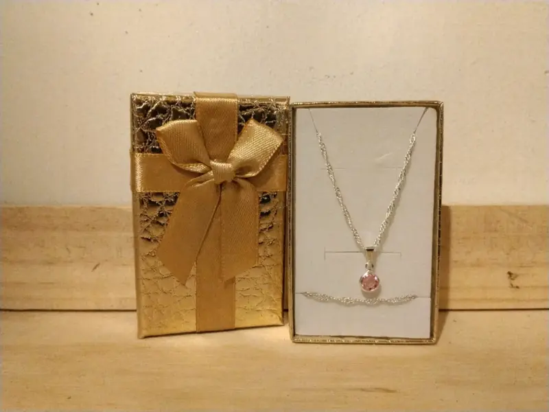 Collar más pulsera de plata con colgante rosa