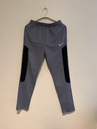 Pantalones deportivos grises Nike - miniatura 1