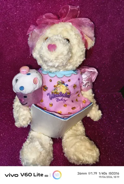 Osito de peluche con lazo rosa - miniatura 1