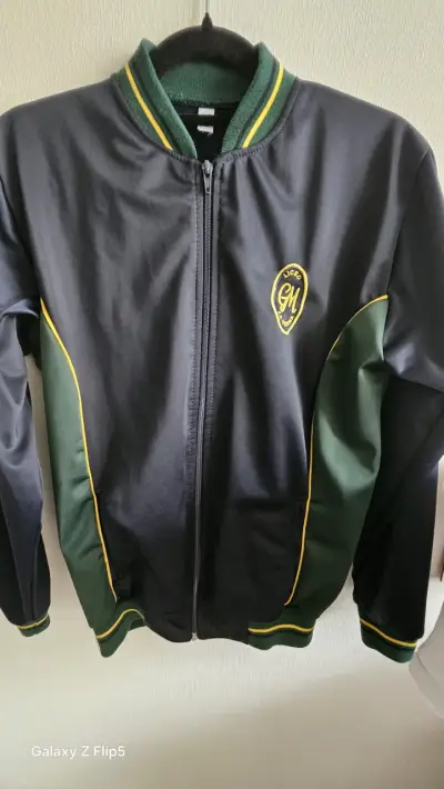 Chaqueta deportiva negra y verde - miniatura 1