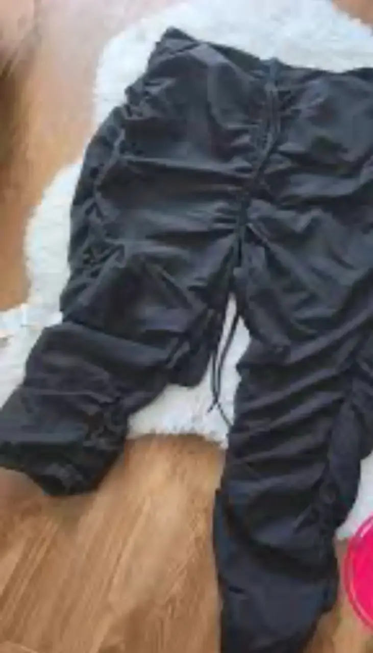 Pantalones negros con cordones - 1