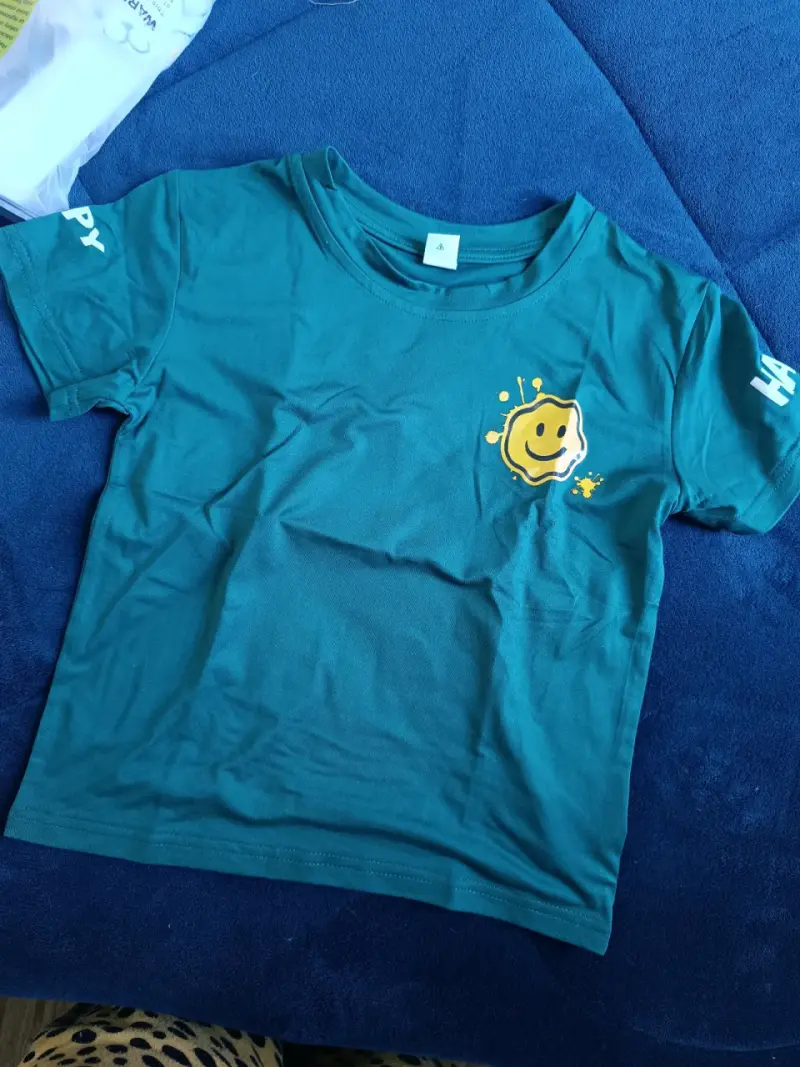 Polera azul con diseño sonriente - 1