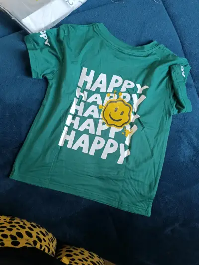 Polera azul con diseño sonriente - miniatura 2