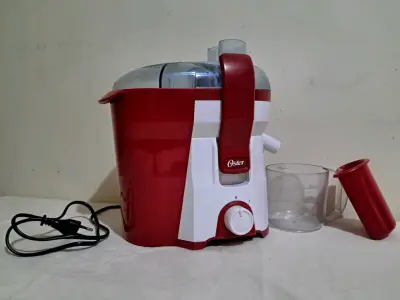 Extractor de jugos Oster rojo 400W - miniatura 1