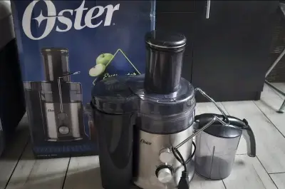Extractor de jugos Oster nuevo - miniatura 2