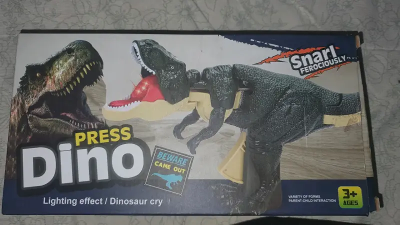 Juguete dinosaurio con efectos