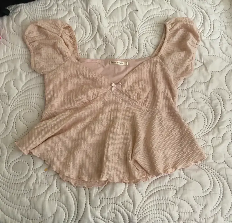 Blusa rosa con mangas abullonadas talla M