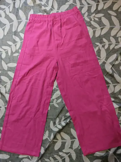Pantalones rosados de tela - miniatura 1