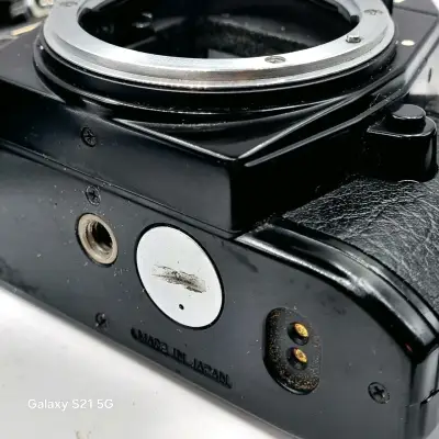 Cuerpo y motor Nikon EM manual con detalles - miniatura 5