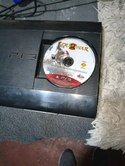 Consola PS3 con juego God of War - miniatura 1