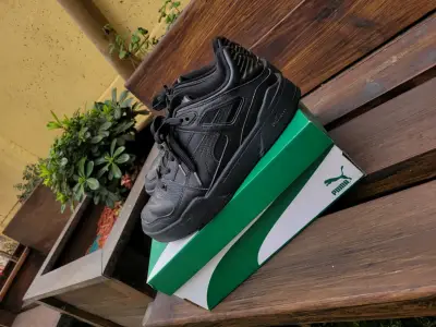 Zapatillas negras Puma - miniatura 1