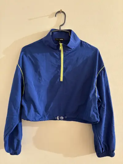 Chaqueta azul con cierre amarillo - miniatura 1