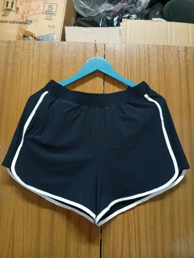 Shorts deportivos azul con franjas - miniatura 1