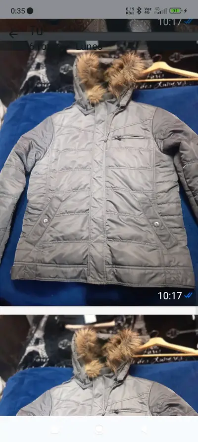 Chaqueta gris con capucha - miniatura 1