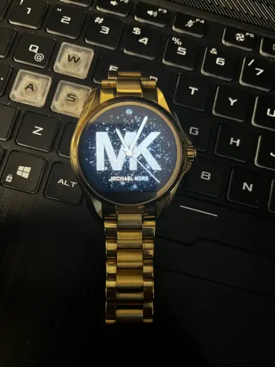 Reloj inteligente dorado michael kors - miniatura 1