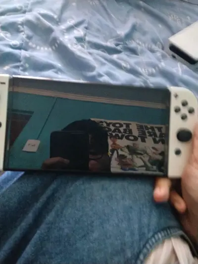 Nintendo switch oled más el grip y el mando - miniatura 1