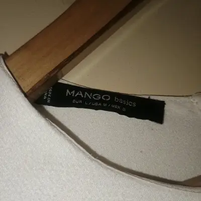 Blusa sin mangas blanca elegante - miniatura 4